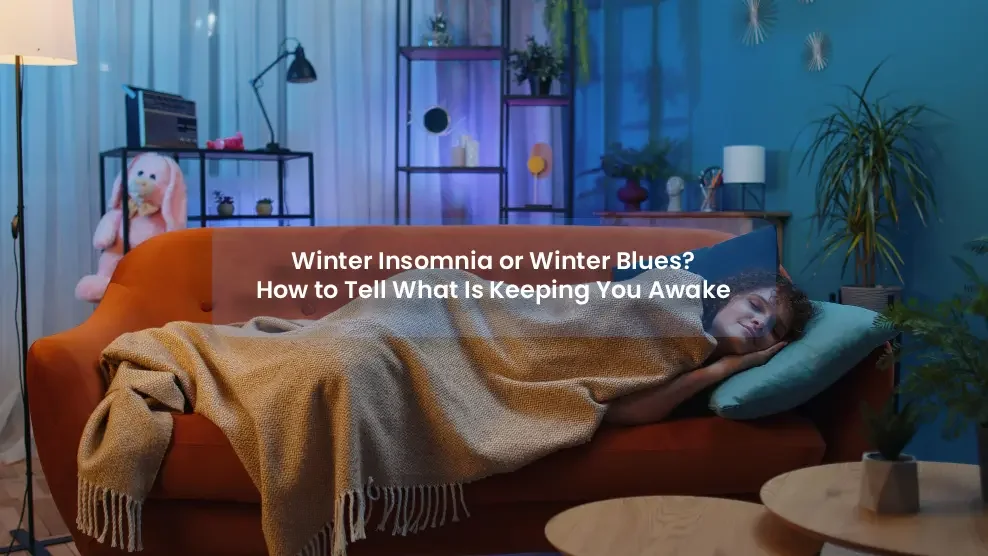 Person sleeping on an orange couch, covered with a blanket in a cozy, dim room. Text on image: "Winter Insomnia or Winter Blues?"